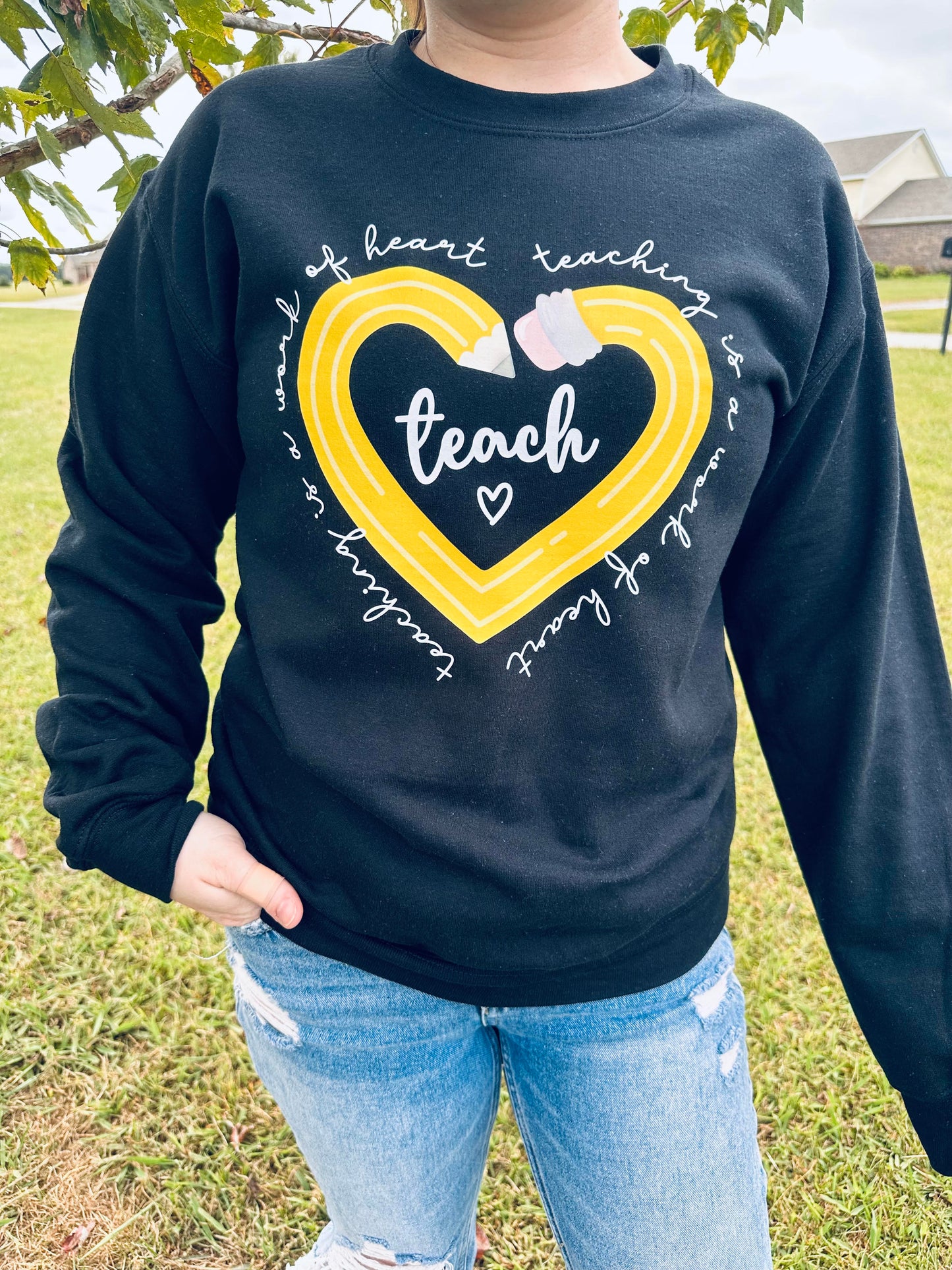 Teaching is a work of art crewneck